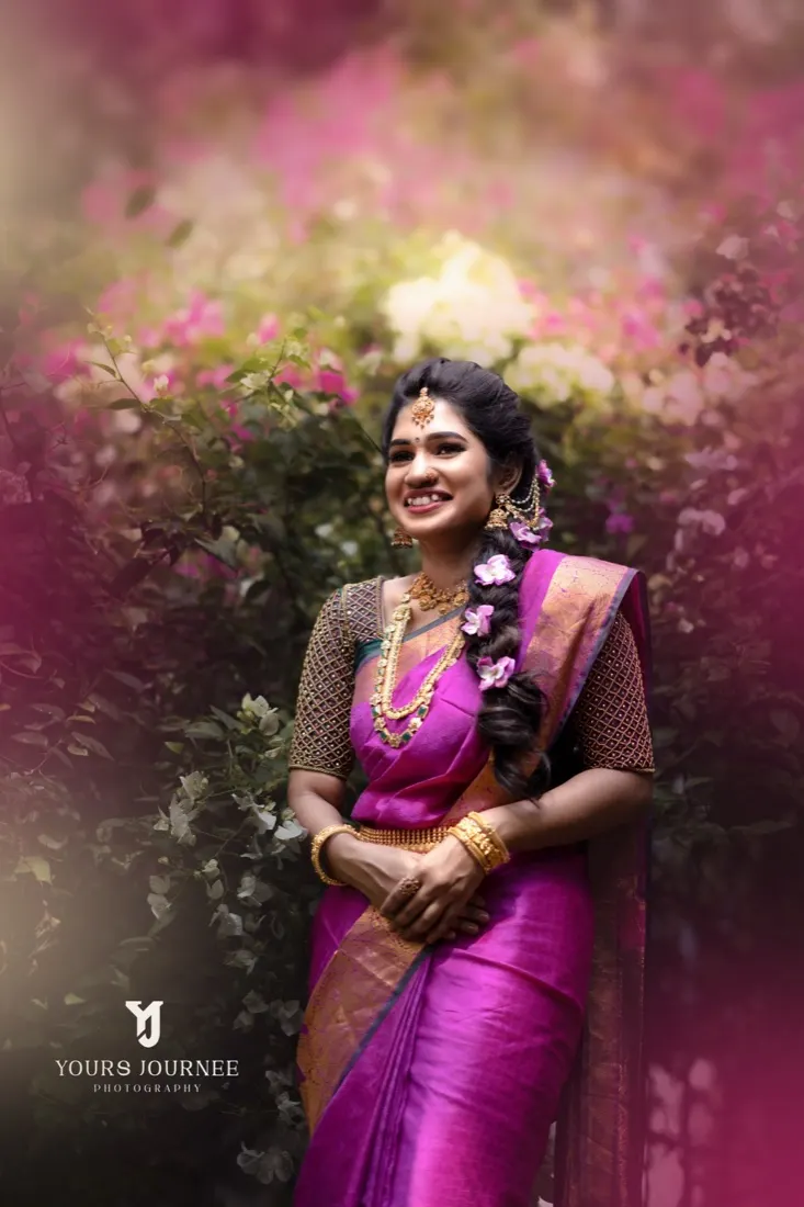 Bride in magenta silk framed by pink bougainvillea