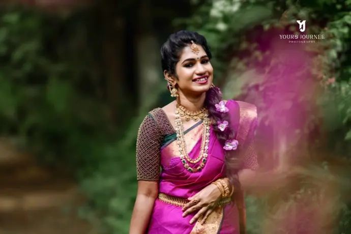 Bride among blossoms in magenta silk